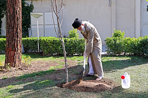 FILE &#151; In this Tuesday, March 3, 2020 file photo released by an official website of the office of the Iranian supreme leader, Supreme Leader Ayatollah Ali Khamenei, 80, wears disposable gloves at a tree-planting ceremony in Tehran, Iran. Nine out of 10 cases of the new coronavirus in the Middle East come from the Islamic Republic. Days of denials gave the virus time to spread as the country marked the 41st anniversary of its 1979 Islamic Revolution. For most people, the virus causes only mild or moderate symptoms. For some it can cause more severe illness. (Office of the Iranian Supreme Leader via AP, File)