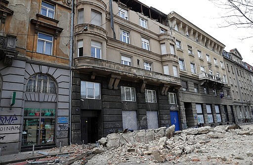 Debris and rubble from damaged buildings fill the street after an earthquake in Zagreb, Croatia, Sunday, March 22, 2020. A strong earthquake shook Croatia and its capital on Sunday, causing widespread damage and panic. (AP Photo/Darko Bandic)