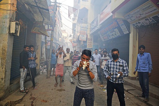 Indians bang pans, blow con shells and claps in show of appreciation to health care workers in Prayagraj, India, Sunday, March 22, 2020. India is observing a 14-hour &quot;people's curfew&quot; called by Prime Minister Narendra Modi in order to stem the rising coronavirus caseload in the country of 1.3 billion. For most people, the new coronavirus causes only mild or moderate symptoms. For some it can cause more severe illness (AP Photo/Rajesh Kumar Singh)