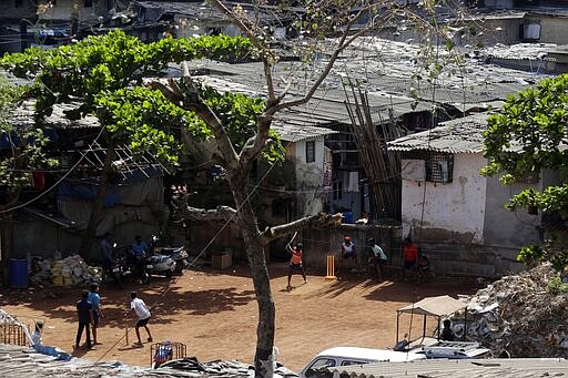 People play cricket in Mumbai, India, Sunday, March 22, 2020. India is Sunday observing a 14-hour &quot;people's curfew&quot; called by Prime Minister Narendra Modi in order to stem the rising coronavirus caseload in the country of 1.3 billion For most people, the new coronavirus causes only mild or moderate symptoms. For some it can cause more severe illness. (AP Photo/Rajanish Kakade)