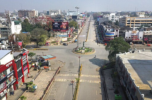 A view of a deserted square in Prayagraj, India, Sunday, March 22, 2020. India is observing a 14-hour &#147;people's curfew&#148; called by Prime Minister Narendra Modi in order to stem the rising coronavirus caseload in the country of 1.3 billion. For most people, the new coronavirus causes only mild or moderate symptoms. For some it can cause more severe illness. (AP Photo/Rajesh Kumar Singh)