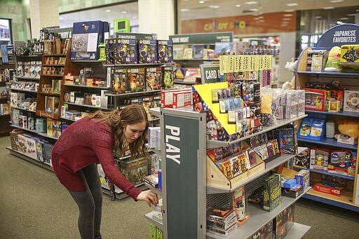 Reanne Rodgers shops for games at Barnes and Nobles at Grand Teton Mall in Idaho Falls, Idaho on Monday, March 23, 2020. Rodgers says she and her husband were shopping for games to have something to do while staying indoors and having over a few select friends. (John Roark/The Idaho Post-Register via AP)/The Idaho Post-Register via AP)