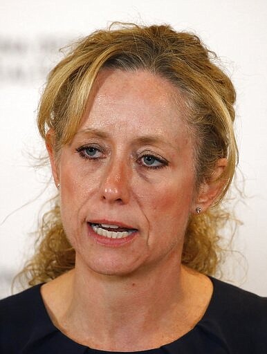 Arizona Department of Health Services Director Dr. Cara Christ answers a question as she provides an update on the coronavirus during a news conference at the Arizona State Public Health Laboratory Monday, March 23, 2020, in Phoenix. (AP Photo/Ross D. Franklin)