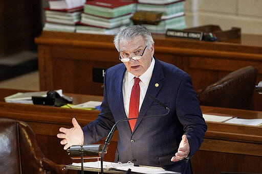 State Sen. John Stinner of Gering, chair of the Appropriations Committee, addresses lawmakers at the State Capitol in Lincoln, Neb., Monday, March 23, 2020. Nebraska lawmakers reconvened on Monday to pass emergency funding for the coronavirus outbreak. (AP Photo/Nati Harnik)