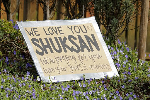 A sign of support that reads &quot;We love you Shuksan&quot; is shown near the entrance of the Shuksan Healthcare Center in Bellingham, Wash., Monday, March 23, 2020. The skilled nursing center had 29 new cases of the new coronavirus confirmed on Sunday in both residents and employees according to the Whatcom County Health Department. (AP Photo/Ted S. Warren)