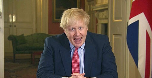 In this screen grab taken from video, Britain's Prime Minister Boris Johnson addresses the nation from 10 Downing Street, in London, Monday March 23, 2020. Johnson has ordered the closure of most retail stores and banned gatherings for three in a stepped-up response to slow the new coronavirus. The measures Johnson announced in an address to the nation on Monday night a mark a departure from the British government's until-now more relaxed approach to the worldwide COVID-19 pandemic. (UK Pool via AP)