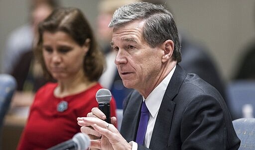 Gov. Roy Cooper speaks to officials from across the state that make up the Coronavirus Task Force during their meeting in Raleigh, N.C. on Thursday, March 12, 2020. (Julia Wall/The News &amp; Observer via AP)