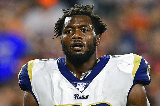 FLE - In this Sept. 22, 2019, file photo, Los Angeles Rams defensive end Dante Fowler stands during the second half of an NFL football game against the Cleveland Browns, in Cleveland. A person familiar with the deal says the Atlanta Falcons have agreed to sign outside linebacker Dante Fowler. The person spoke to The Associated Press on condition of anonymity because free-agent signings can't be announced until after the league year begins Wednesday afternoon, March 18, 2020. (AP Photo/David Dermer, File)