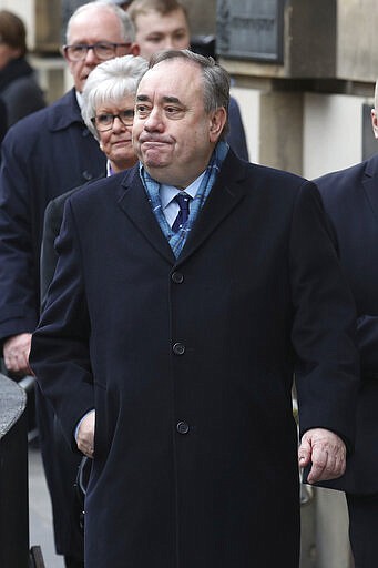 Alex Salmond leaves the High Court after he was cleared of attempted rape and a series of sexual assaults, including one with intent to rape, against nine women, who were all either working for the Scottish Government or within the SNP at the time, in Edinburgh, Monday March 23, 2020. (Andrew Milligan/PA via AP)