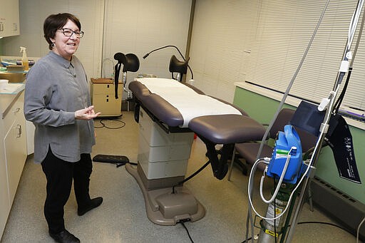 FILE - In this Feb. 25, 2020, file photo, Executive Director Chrisse France talks about Preterm, the busiest abortion clinic in Ohio, in the procedure room in Cleveland. The governor and attorney general of Texas are moving to ban most abortions in the state during the coronavirus outbreak, declaring they don't qualify as essential surgeries. (AP Photo/Tony Dejak, File)