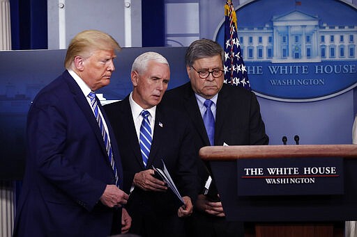 Vice President Mike Pence walks to the podium past President Donald Trump and Attorney General William Barr during a coronavirus briefing in the James Brady Briefing Room, Monday, March 23, 2020, in Washington. (AP Photo/Alex Brandon)