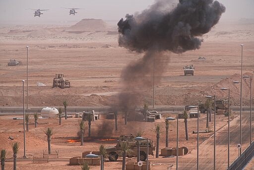 Emirati forces advance by land and air during an exercise at an Emirati military base home to a Military Operations in Urban Terrain facility in al-Hamra, United Arab Emirates, Monday, March 23, 2020. The U.S. military held the major exercise Monday with Emirati troops in the UAE's far western desert at a facility designed to look like a Mideast city amid ongoing tensions with Iran. (AP Photo/Jon Gambrell)