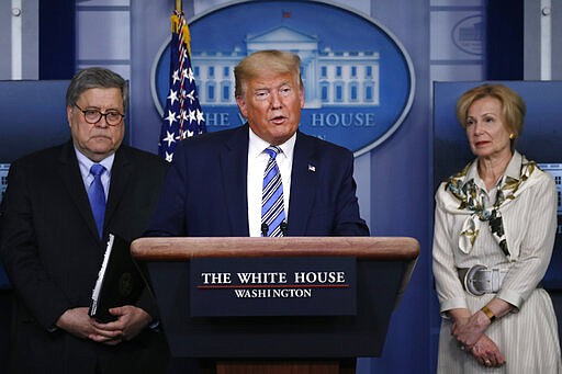 President Donald Trump speaks about the coronavirus in the James Brady Briefing Room, Monday, March 23, 2020, in Washington, as Attorney General William Barr and Dr. Deborah Birx, White House coronavirus response coordinator, listen. (AP Photo/Alex Brandon)