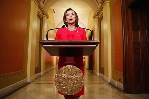 House Speaker Nancy Pelosi of Calif. speaks outside her office on Capitol Hill, Monday, March 23, 2020. (AP Photo/Andrew Harnik, Pool)