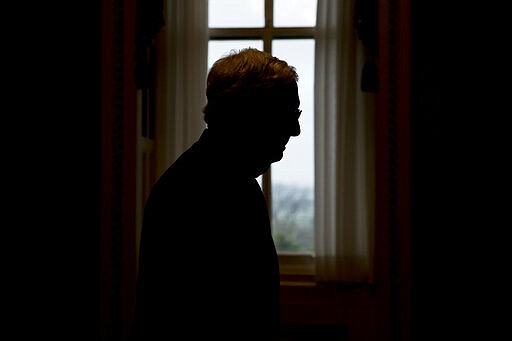 Senate Majority Leader Mitch McConnell of Ky. walks to the Senate Chamber on Capitol Hill in Washington, Monday, March 23, 2020, as the Senate is working to pass a coronavirus relief bill. (AP Photo/Andrew Harnik)