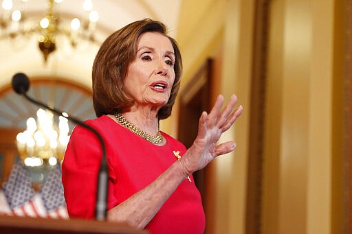 House Speaker Nancy Pelosi of Calif. speaks outside her office on Capitol Hill, Monday, March 23, 2020. (AP Photo/Andrew Harnik, Pool)