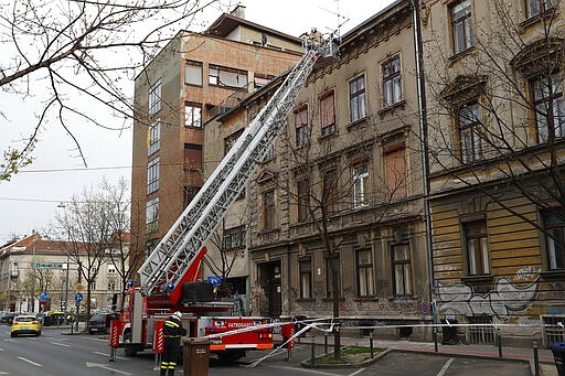 Firemen inspect the damage after an earthquake in downtown Zagreb, Croatia, Monday, March 23, 2020. Croatia experienced a series of aftershocks a day after a strong earthquake triggered widespread damage and injured over 20 people in the capital. (AP Photo/Darko Bandic)