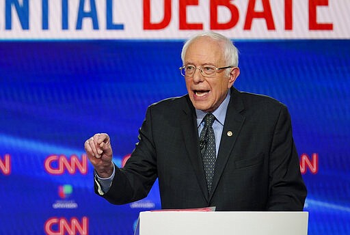 In this Sunday, March 15, 2020, photo, Sen. Bernie Sanders, I-Vt., with former Vice President Joe Biden, speaks during a Democratic presidential primary debate at CNN Studios in Washington. What might be the final showdown between the two very different Democratic candidates takes place Tuesday, March 17, 2020, during Florida's presidential primary. (AP Photo/Evan Vucci)