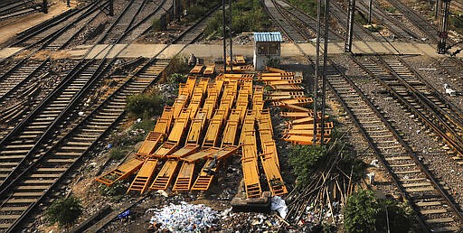 Hand pushed carts of railway porters are stacked together next to the railway lines at the New Delhi railway station during a lockdown amid concerns over the spread of Coronavirus, in New Delhi, India, Monday, March 23, 2020. Authorities have gradually started to shutdown much of the country of 1.3 billion people to contain the outbreak. For most people, the new coronavirus causes only mild or moderate symptoms. For some it can cause more severe illness. (AP Photo/Manish Swarup)