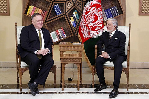 U.S. Secretary of State Mike Pompeo, left, meets with Abdullah Abdullah the main political rival of President Ashraf Ghani at the Sepidar Palace, in Kabul, Afghanistan, Monday, March 23, 2020. Pompeo was in Kabul on an urgent visit Monday to try to move forward a U.S. peace deal signed last month with the Taliban, a trip that comes despite the coronavirus pandemic, at a time when world leaders and statesmen are curtailing official travel. (Sepidar Palace via AP)