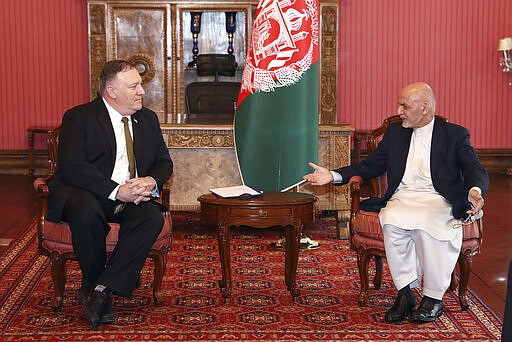 U.S. Secretary of State Mike Pompeo, left, meets with Afghan President Ashraf Ghani, at the Presidential Palace in Kabul, Afghanistan, Monday, March 23, 2020. Pompeo was in Kabul on an urgent visit Monday to try to move forward a U.S. peace deal signed last month with the Taliban, a trip that comes despite the coronavirus pandemic, at a time when world leaders and statesmen are curtailing official travel. (Afghan Presidential Palace via AP)