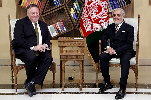 U.S. Secretary of State Mike Pompeo, left, meets with Abdullah Abdullah the main political rival of President Ashraf Ghani at the Sepidar Palace, in Kabul, Afghanistan, Monday, March 23, 2020. Pompeo was in Kabul on an urgent visit Monday to try to move forward a U.S. peace deal signed last month with the Taliban, a trip that comes despite the coronavirus pandemic, at a time when world leaders and statesmen are curtailing official travel. (Sepidar Palace via AP)