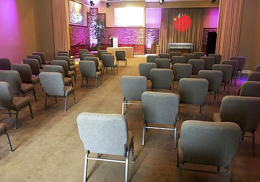 This March 19, 2020 photo provided by Bob Arrington of Arrington Funeral Directors shows a viewing room with seating arranged to facilitate social distancing amid the coronavirus outbreak, at their funeral home in Jackson, Tenn. (Cliff Walker Jr./Arrington Funeral Directors via AP)