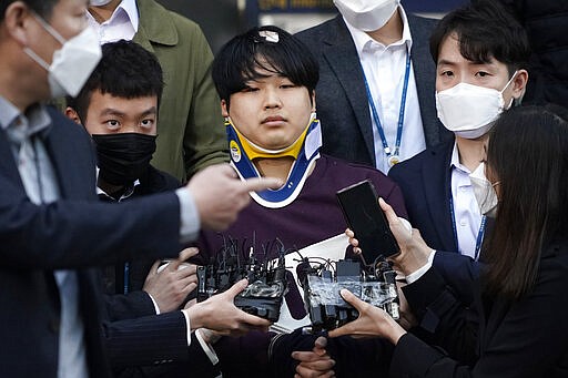 Cho Ju-bin, leader of South Korea's online sexual blackmail ring which is so called &quot;Nth room,&quot; walks out of a police station as he is transferred to prosecutors' office for further investigation in Seoul, South Korea, Wednesday, March 25, 2020. South Korean prosecutors on Wednesday began reviewing whether to formally charge the man arrested last week on allegations he operated secretive chatrooms where he posted sexually abusive videos of blackmailed women in return for cryptocurrency payments. (Kim Hong-Ji/Pool Photo via AP)