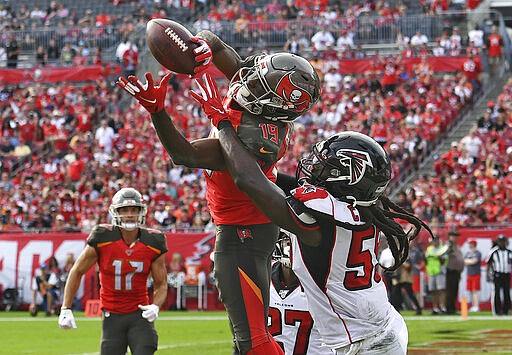 FILE - In this Dec. 29, 2019, file photo, Tampa Bay Buccaneers wide receiver Breshad Perriman (19) pulls in a 24-yard touchdown reception in front of Atlanta Falcons outside linebacker De'Vondre Campbell (59) during the first half of an NFL football game in Tampa, Fla. Perriman agreed to terms Tuesday with the New York Jets on a one-year deal worth up to $8 million and includes $6 million guaranteed, agent Drew Rosenhaus told The Associated Press. (AP Photo/Jason Behnken, File)