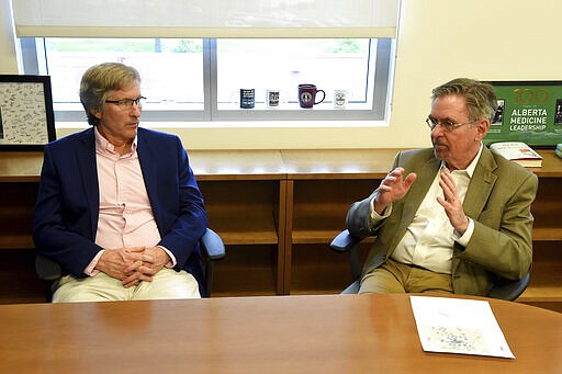 Dean of the Medical College of Georgia (MCG) Dr. David Hess, left, and and MCG Vice Dean for Academic Affairs Dr. Doug Miller talk about their plan to allow third and fourth-year students to take a pandemic elective, which will allow them to earn credit and experience while helping the state respond to the coronavirus crisis by fanning out across Georgia to help underserved areas. Photographed in Augusta, Ga., Monday, March 23, 2020. (Michael Holahan/The Augusta Chronicle via AP)