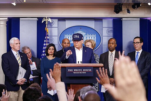 President Donald Trump speaks during briefing on coronavirus in the Brady press briefing room at the White House, Saturday, March 14, 2020, in Washington. Listening on the podium from left are, Vice President Mike Pence,, Dr. Anotny Fauci, Director of the National Institute of Allergy and Infectious Diseases at the National Institutes of Health, Administrator of the Centers for Medicare and Medicaid Services Seema Verma, U.S. Surgeon General Jerome Adams, Dr. Deborah Birx, White House coronavirus response coordinator,, Housing and Urban Development Secretary Ben Carson, and Treasury Secretary Steven Mnuchin. (AP Photo/Alex Brandon)