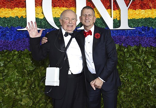 FILE - This June 9, 2019 file photo shows playwright Terrence McNally, left, and Tom Kirdahy at the 73rd annual Tony Awards in New York.  McNally, one of America&#146;s great playwrights whose prolific career included winning Tony Awards for the plays &quot;Love! Valour! Compassion!&quot; and &quot;Master Class&quot; and the musicals &quot;Ragtime&quot; and &quot;Kiss of the Spider Woman,&quot; died Tuesday, March 24, 2020, of complications from the coronavirus. He was 81. (Photo by Evan Agostini/Invision/AP, File)