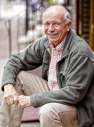FILE - This May 14, 2006 file photo shows Tony Award winning playwright Terrence McNally in front of the Philadelphia Theater Company  in Philadelphia. McNally, one of Americas great playwrights whose prolific career included winning Tony Awards for the plays "Love! Valour! Compassion!" and "Master Class" and the musicals "Ragtime" and "Kiss of the Spider Woman," died Tuesday, March 24, 2020, of complications from the coronavirus. He was 81. (AP Photo/H. Rumph Jr)