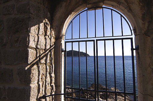 This Tuesday, March 17, 2020 photo shows the door of the Lazarettos complex, called Lazareti in Croatian, in Dubrovnik, Croatia. Just outside the majestic walls of Croatia&#146;s medieval citadel city of Dubrovnik lies a cluster of small stone houses that today serve as an art and clubbing hub. But as the coronavirus spreads across the globe, many are being reminded of the Lazareti complex&#146;s original use as an ancient quarantine area that helped keep infectious diseases away. (AP Photo/Darko Bandic)