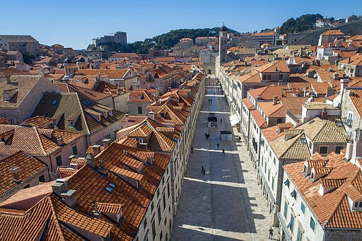 This Tuesday, March 17, 2020 aerial photo shows the old town of Dubrovnik, Croatia. Just outside the majestic walls of Croatia&#146;s medieval citadel city of Dubrovnik lies a cluster of small stone houses known as the Lazarettos, called Lazareti in Croatian, of Dubrovnik, today an art and clubbing hub and a tourist attraction. But the coronavirus spreads worldwide, some are recalling their original purpose centuries ago as an isolation zone for arrivals who might be carrying infectious diseases. Dubrovnik, on the Adriatic coast, was the first city in Europe to set up a quarantine system, in 1377, as protection from leprosy. The Lazzarettos complex was built in the 17th century when authorities decided to set up the quarantine area closer to the harbor. (AP Photo/Darko Bandic)