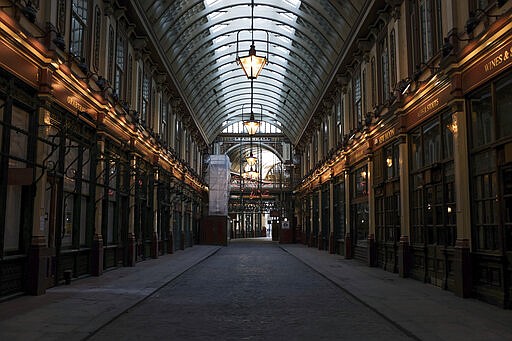 General view of the normally busy, but now deserted Lendenhall Market, in central London, Tuesday, March 24, 2020. Britain's Prime Minister Boris Johnson on Monday imposed its most draconian peacetime restrictions on businesses and gatherings, health workers begged for more gear, saying they felt like &quot;cannon fodder.&quot; For most people, the new coronavirus causes only mild or moderate symptoms. For some it can cause more severe illness.(AP Photo/Alberto Pezzali)