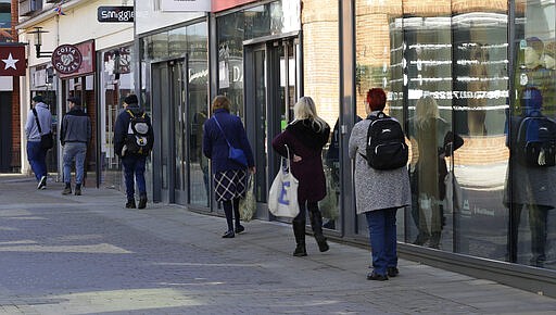 People use social distancing as they queue to enter a supermarket in Windsor, England Tuesday, March 24, 2020. Britain's Prime Minister Boris Johnson on Monday imposed its most draconian peacetime restrictions due to the spread of the coronavirus on businesses and gatherings. For most people, the new coronavirus causes only mild or moderate symptoms. For some it can cause more severe illness.(AP Photo/Kirsty Wigglesworth)