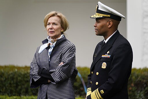 Dr. Deborah Birx, White House coronavirus response coordinator and Surgeon General Jerome Adams arrive for a Fox News Channel virtual town hall at the White House, Tuesday, March 24, 2020, in Washington. (AP Photo/Evan Vucci)