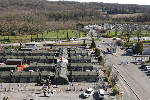 The military field hospital built in Mulhouse, eastern France, is pictured Monday March 23, 2020. The Grand Est region is now the epicenter of the outbreak in France, which has buried the third most virus victims in Europe, after Italy and Spain. For most people, the new coronavirus causes only mild or moderate symptoms. For some it can cause more severe illness.  (AP Photo/Jean-Francois Badias)