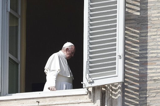 Pope Francis leaves after delivering his blessing at the Vatican, Sunday, March 22, 2020. During his weekly Sunday blessing, held due to virus concerns in his private library in the Apostolic Palace, he urged all Christians to join in reciting the &#145;&#146;Our Father&#146;&#146; prayer next Wednesday at noon. And he said that he would lead a global blessing to an empty St. Peter&#146;s Square on Friday. For most people, the new coronavirus causes only mild or moderate symptoms. For some it can cause more severe illness, especially in older adults and people with existing health problems. (AP Photo/Andrew Medichini)