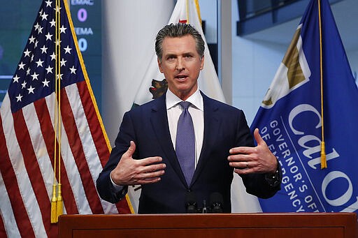 Gov. Gavin Newsom updates the state's response to the coronavirus at the Governor's Office of Emergency Services in Rancho Cordova, Calif., Monday, March 23, 2020. Newsom said he would close parking lots at dozens of beaches and state parks to prevent the spread of coronavirus after large groups flocked to the coast and mountains to get outdoors on the first weekend since the state's stay-at-home order took effect. (AP Photo/Rich Pedroncelli, Pool)