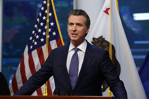 Gov. Gavin Newsom updates the state's response to the coronavirus at the Governor's Office of Emergency Services in Rancho Cordova, Calif., Monday, March 23, 2020. Newsom said he would close parking lots at dozens of beaches and state parks to prevent the spread of coronavirus after large groups flocked to the coast and mountains to get outdoors on the first weekend since the state's stay-at-home order took effect.  (AP Photo/Rich Pedroncelli, Pool)