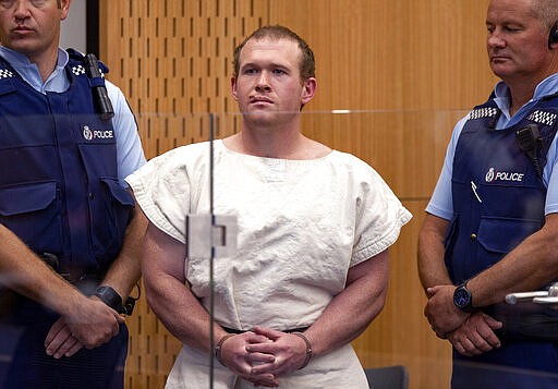 FILE - In this Saturday, March 16, 2019, file photo, Brenton Tarrant, the man charged in relation to the Christchurch mosque shootings, appears in the Christchurch District Court, in Christchurch, New Zealand. One year after killing 51 worshipers at two Christchurch mosques, Tarrant, an Australian white supremacist accused of the slaughter on Thursday, March 26, 2020, changed his plea to guilty. (Mark Mitchell/Pool via AP, File)