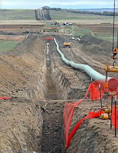 FILE - In this October 2016, file photo, construction continues on the Dakota Access Pipeline. A federal judge on Wednesday, March 25, 2020, ordered the U.S. Army Corps of Engineers to conduct a full environmental review of the Dakota Access pipeline, nearly three years after it began carrying oil.(Tom Stromme/The Bismarck Tribune via AP, File)