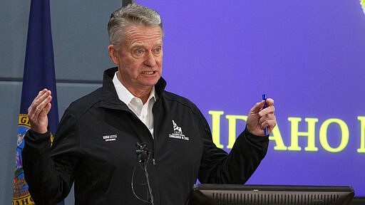 Idaho Gov. Brad Little issues a statewide stay-at-home order to further prevent spread of coronavirus at a press conference, Wednesday, March 25, 2020 held at Gowen Field, headquarters of the Idaho Army National Guard in Boise, Idaho. (Darin Oswald/Idaho Statesman via AP)