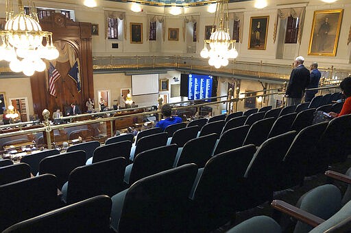 Several members of the South Carolina House choose to practice social distancing and sit in the balcony on Thursday, March 19, 2020, in Columbia, S.C.. The House returned briefly to approve $45 million in emergency funds for state health officials to fight coronavirus.  (AP Photo/Jeffrey Collins)