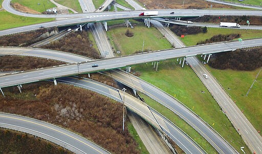 One of the busiest freeway interchanges in Ohio, Interstates 70, 71, and Ohio Rt. 315 appear almost empty Monday morning, March 23, 2020 as business and social lives shut down due to COVID-19. The state issued a stay-at-home order to take effect at 11:59 pm March 23. (Doral Chenoweth/The Columbus Dispatch via AP)