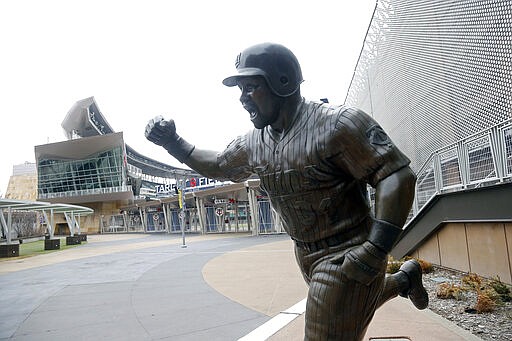 The statue of the late-great player Kirby Puckett stands in the plaza at Target Field, home of the Minnesota Twins baseball team Wednesday, March 25, 2020 in Minneapolis. Though the Twins would open on the road, the start of the regular season is indefinitely on hold because of the coronavirus pandemic. (AP Photo/Jim Mone)