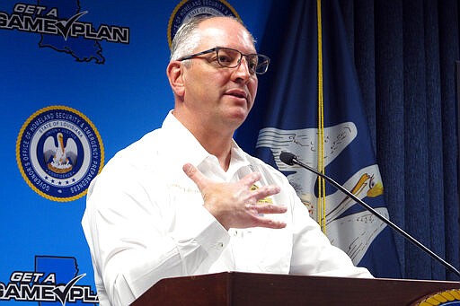 Louisiana Gov. John Bel Edwards talks about the rise in his state's coronavirus cases, Wednesday, March 25, 2020, in Baton Rouge, La. Louisiana is scrambling to ready makeshift hospitals and track down ventilators amid a steady uptick in the outbreak. (AP Photo/Melinda Deslatte)