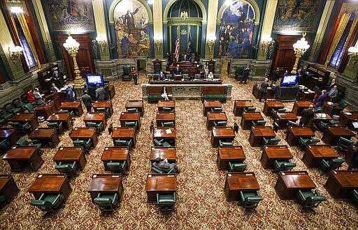 A majority of senators live-streamed the senate session, Wednesday, March 25, 2020, in Harrisburg, Pa. The state Senate is holding a session to vote on changing the primary election date, among other measures. The Senate session is the first in state history where members can meet online and vote remotely due to the coronavirus pandemic. (Dan Gleiter/The Patriot-News via AP)